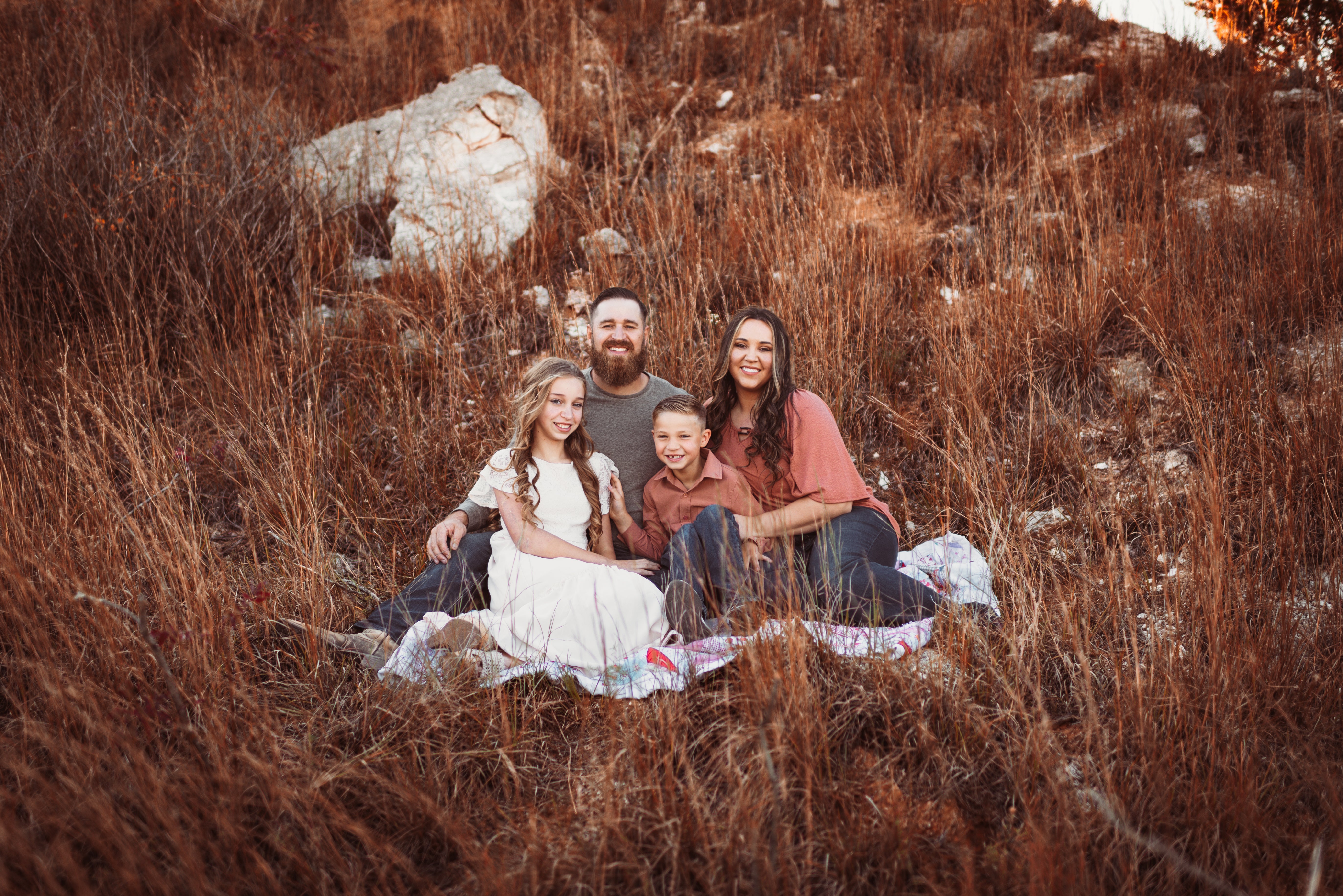 Levi and Sky Evans with their family, founders of EI Corporate Gifts, offering personalized promotional products, custom laser engraved items, and unique corporate gift ideas for businesses and organizations